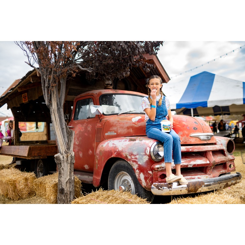 Cookies_Bucket_Girl sitting on truck eating 2_RJ.jpg
